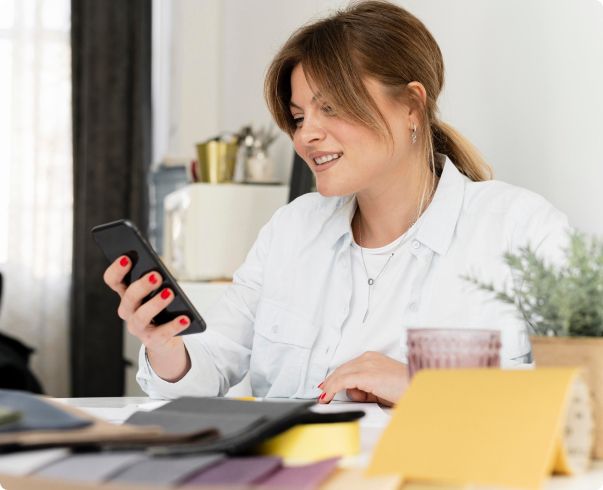 Industry professional checking notes from her telephone answering service